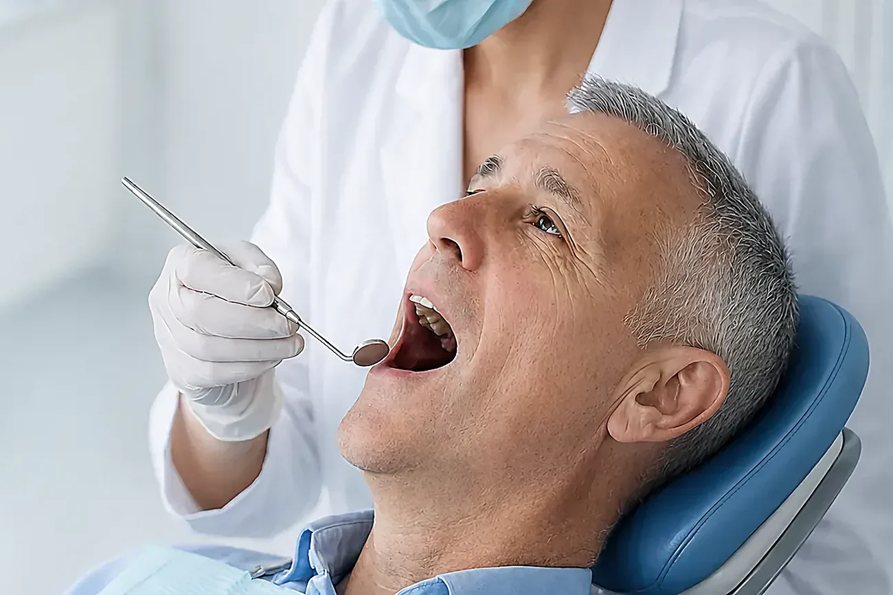 A dentist examining a patient's gums