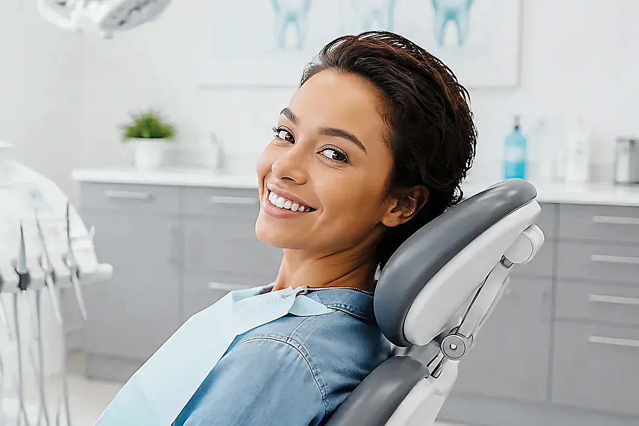 A young woman seated in the dental chair