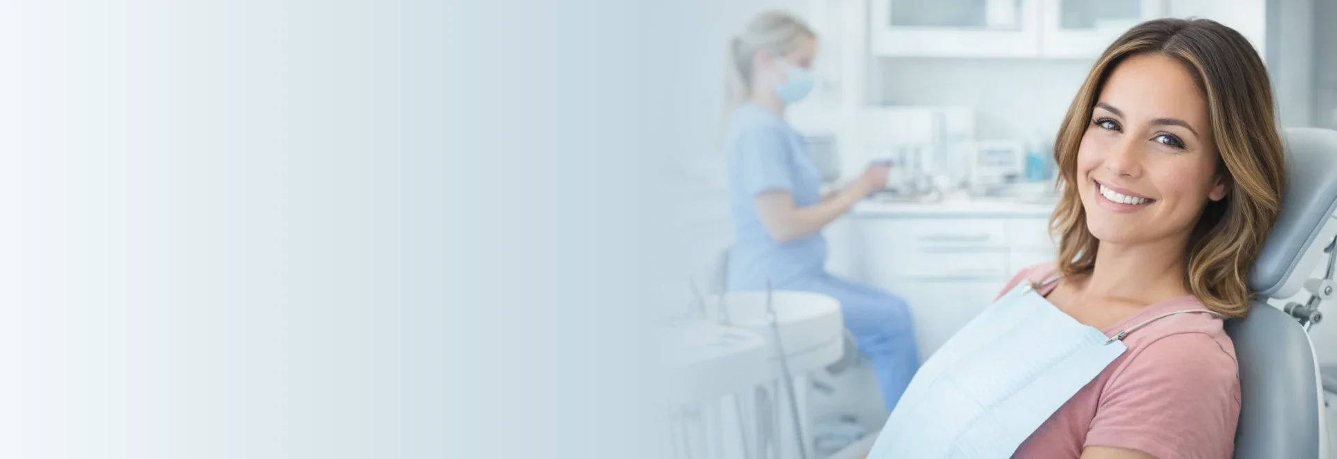 A smiling patient seated in the dental chair