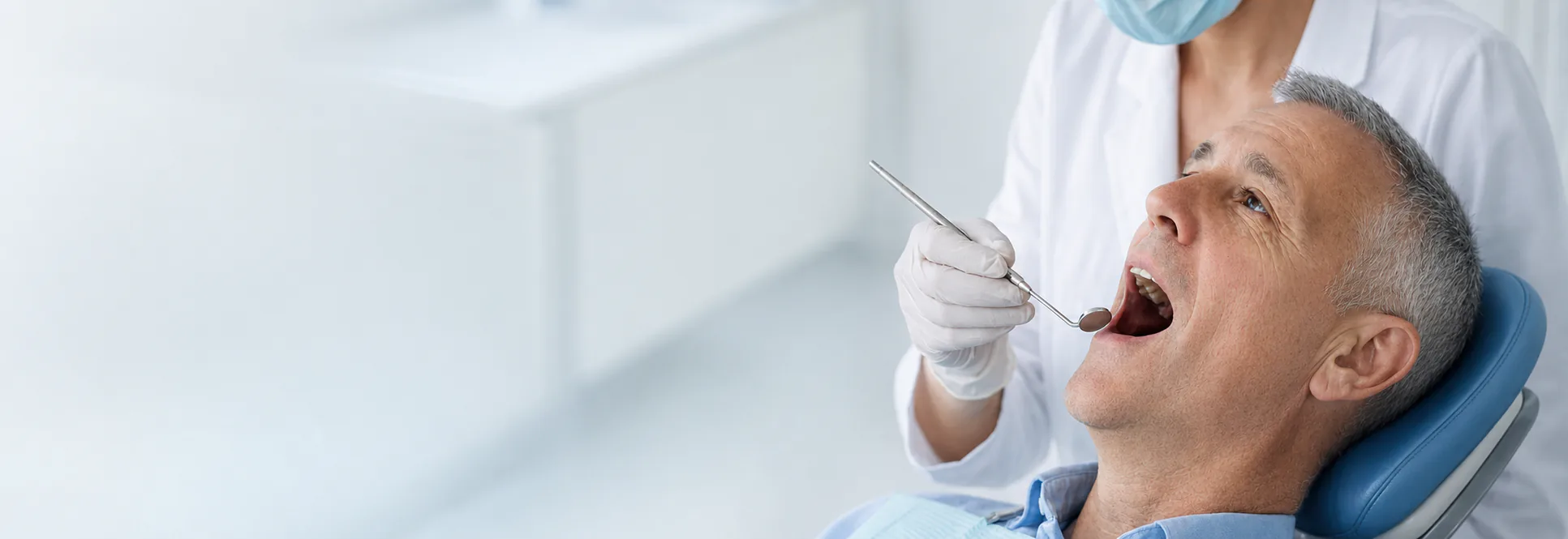 A dentist examining a patient's teeth